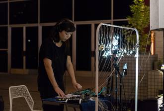 Performing amplified bell controller at MOCA, October 2017. Photo by Ian Byers-Gamber.