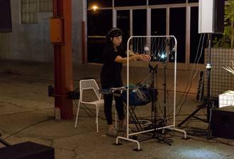 Performing amplified bell controller at MOCA, October 2017. Photo by Ian Byers-Gamber.